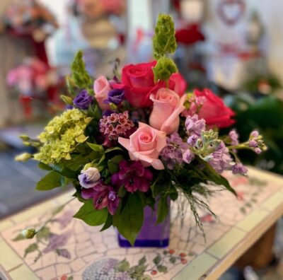 purple paradise vase with fresh cut flowers